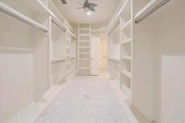 a view of an empty walk in closet