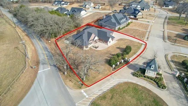 an aerial view of a house with a ocean view