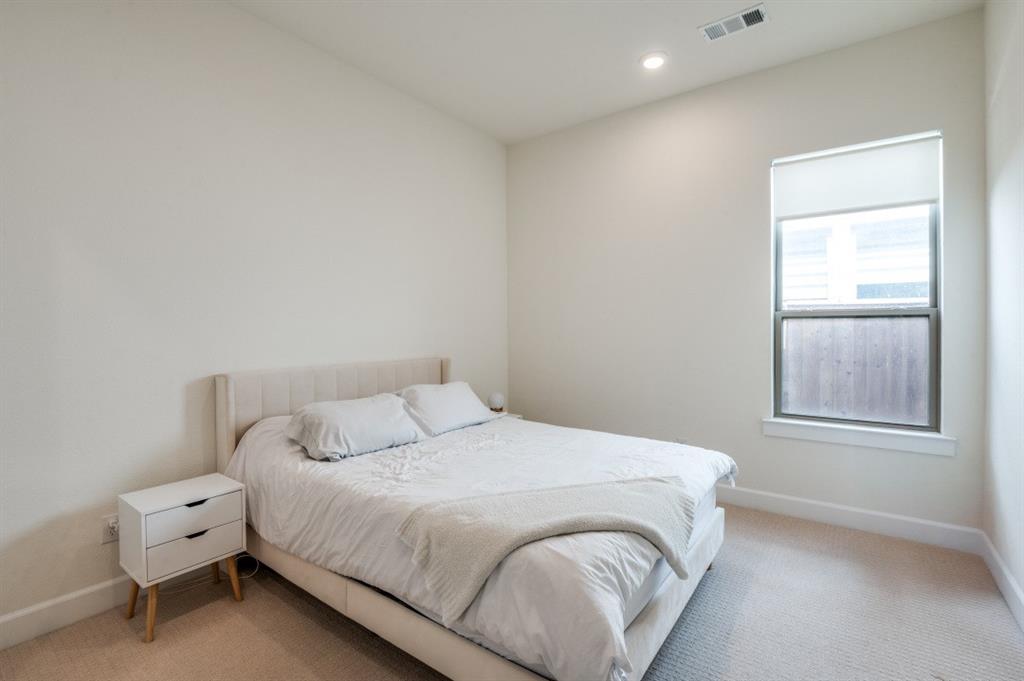 1281 Manfreda Street Prosper, TX 75078 - Photo 15 of 25 a bedroom with a bed and a window