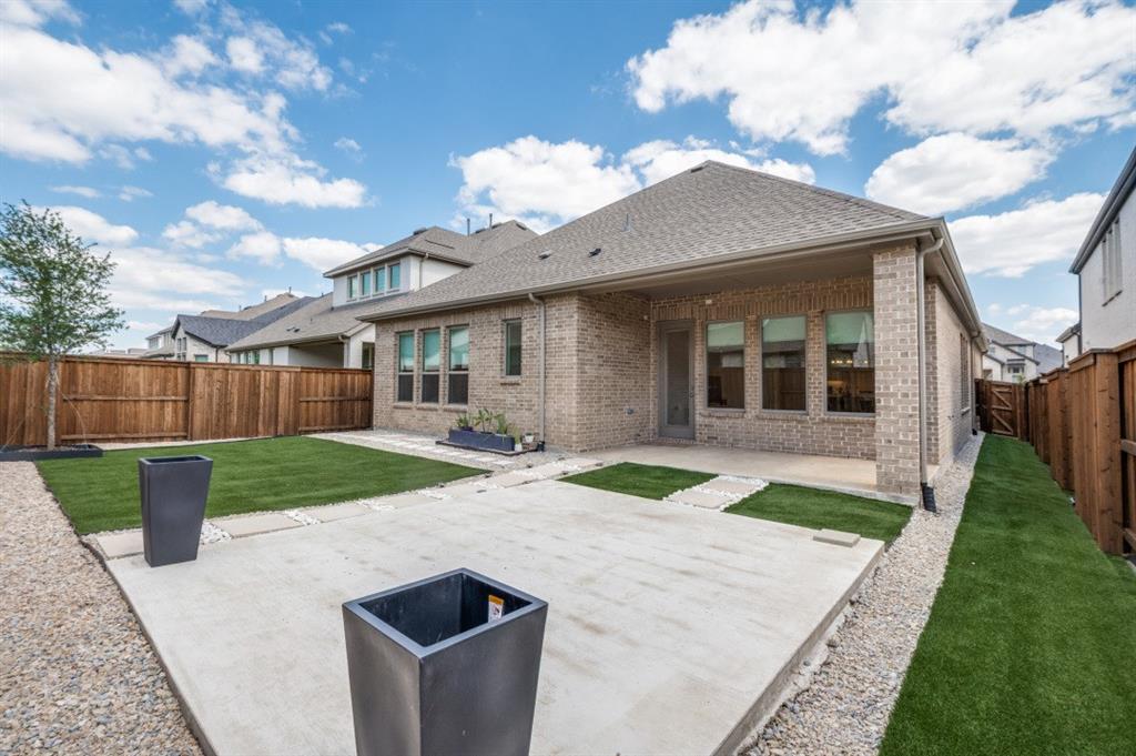 1281 Manfreda Street Prosper, TX 75078 - Photo 22 of 25 a front view of a house with garden