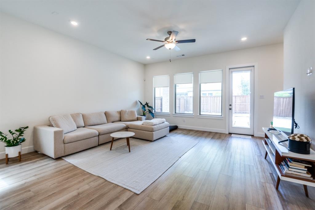 1281 Manfreda Street Prosper, TX 75078 - Photo 6 of 25 a living room with furniture and a wooden floor