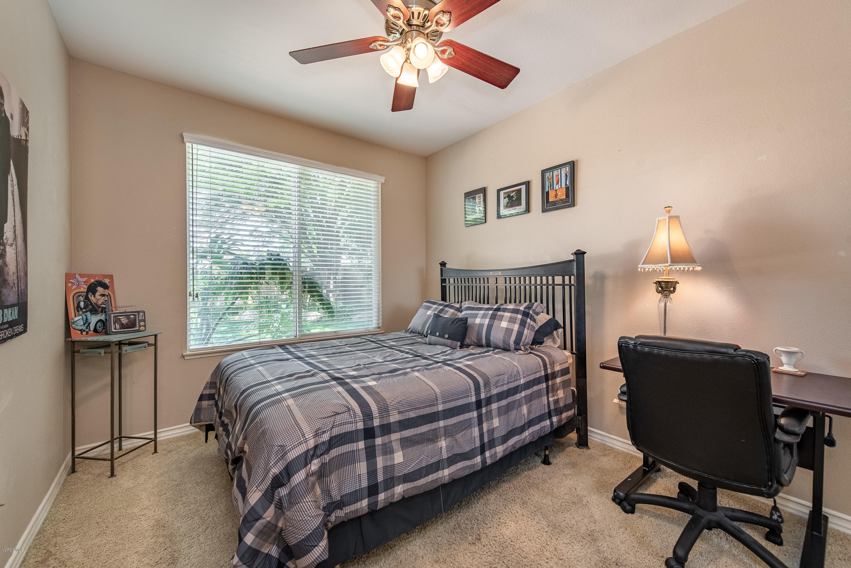 13625 Silver Oak Lane Moorpark, CA 93021 - Photo 17 of 35 a bedroom with a bed and a chandelier