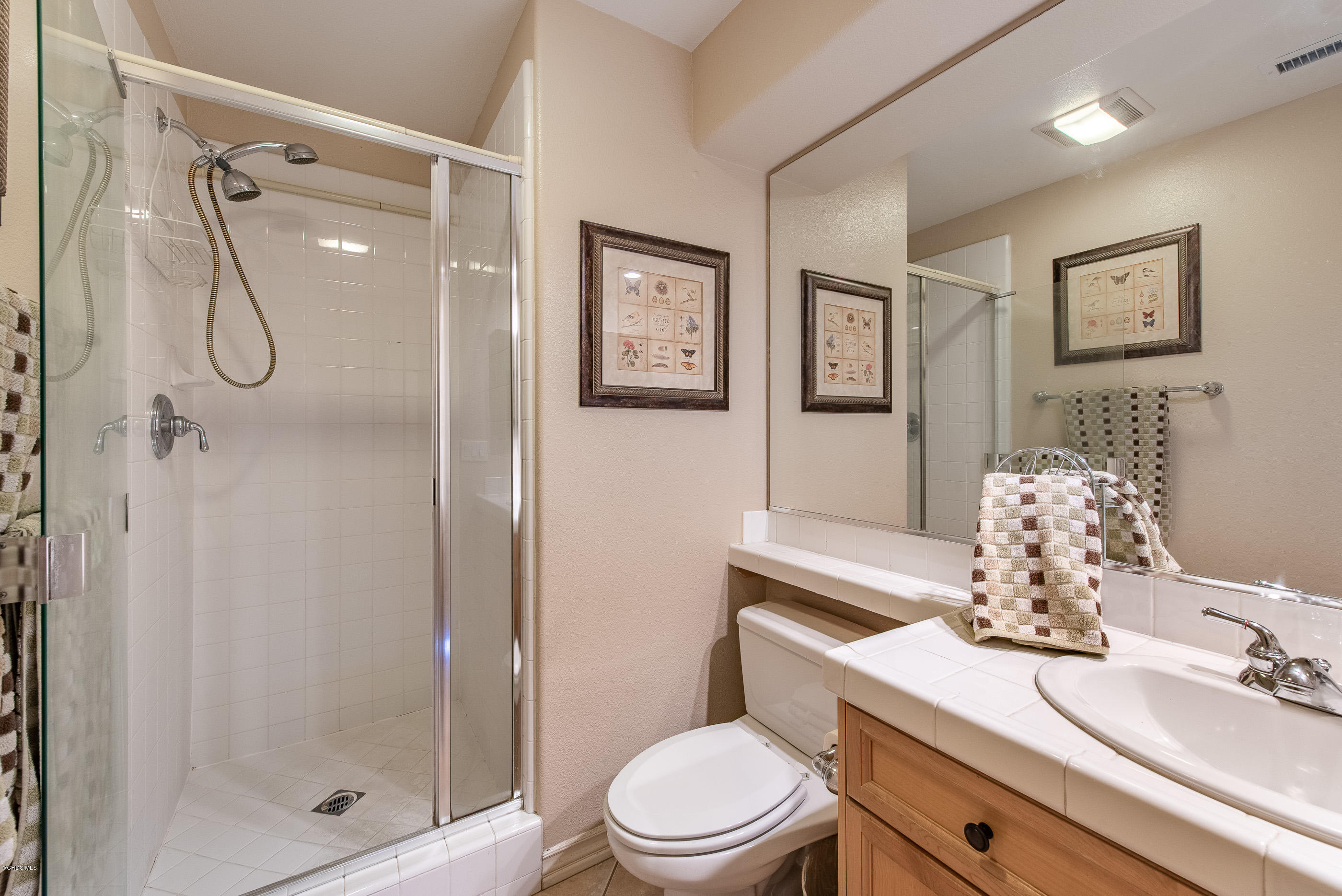 13625 Silver Oak Lane Moorpark, CA 93021 - Photo 18 of 35 a bathroom with a sink toilet and shower