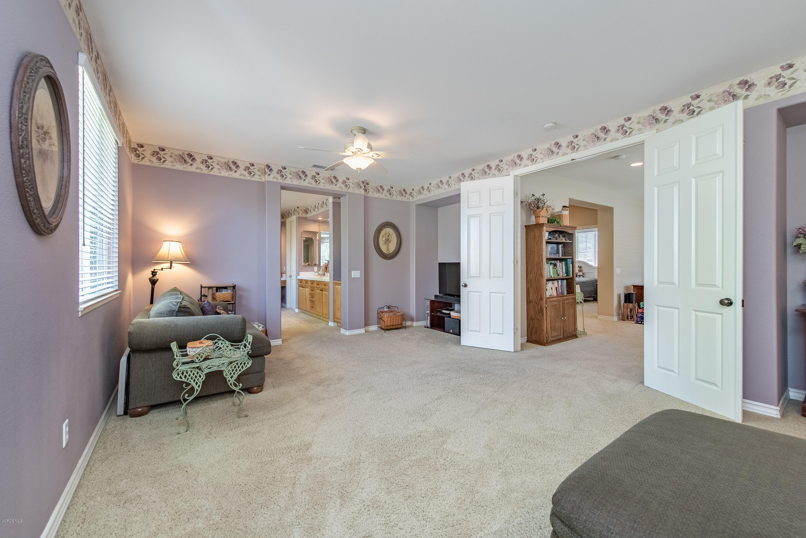 13625 Silver Oak Lane Moorpark, CA 93021 - Photo 22 of 35 a living room with furniture and a chandelier