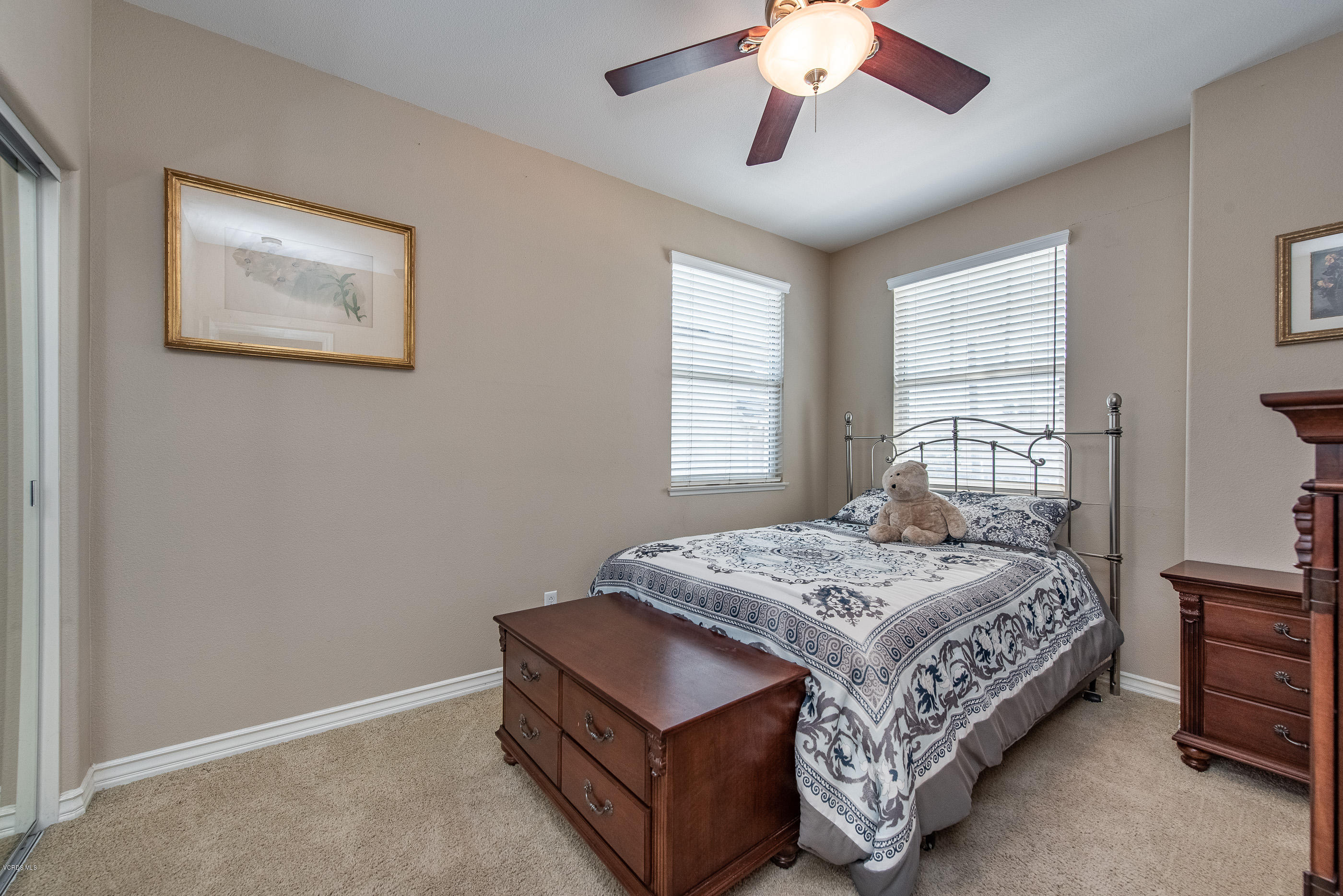 13625 Silver Oak Lane Moorpark, CA 93021 - Photo 29 of 35 a bedroom with a bed lamp and window