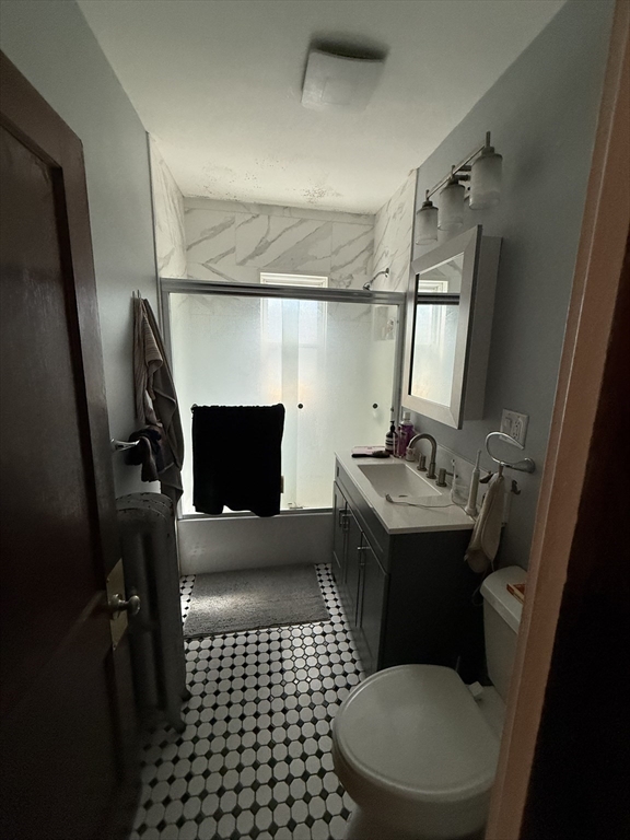 29 Lewis Street, Unit 1 Somerville, MA 02143 - Photo 13 of 16 a bathroom with a sink toilet and shower