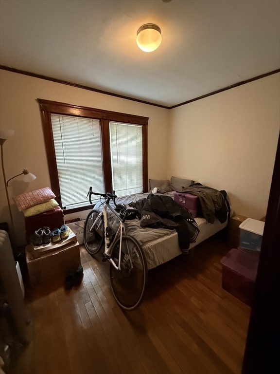 29 Lewis Street, Unit 1 Somerville, MA 02143 - Photo 14 of 16 a bedroom with furniture and a window