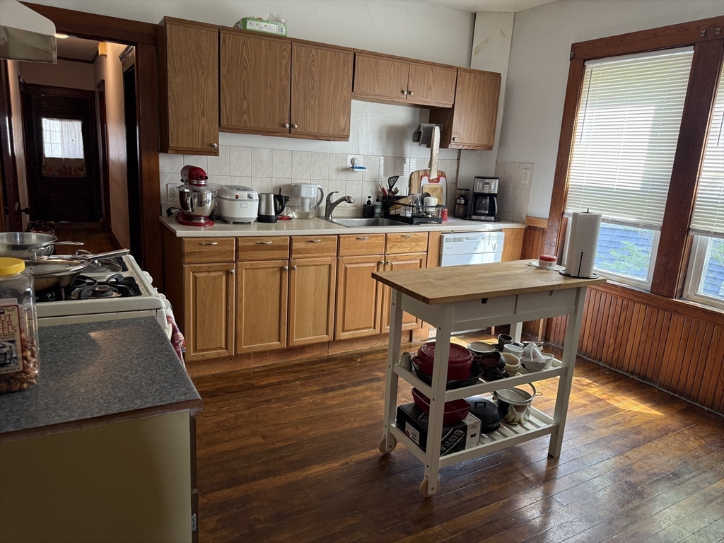 29 Lewis Street, Unit 1 Somerville, MA 02143 - Photo 2 of 16 a kitchen with granite countertop a sink appliances and cabinets