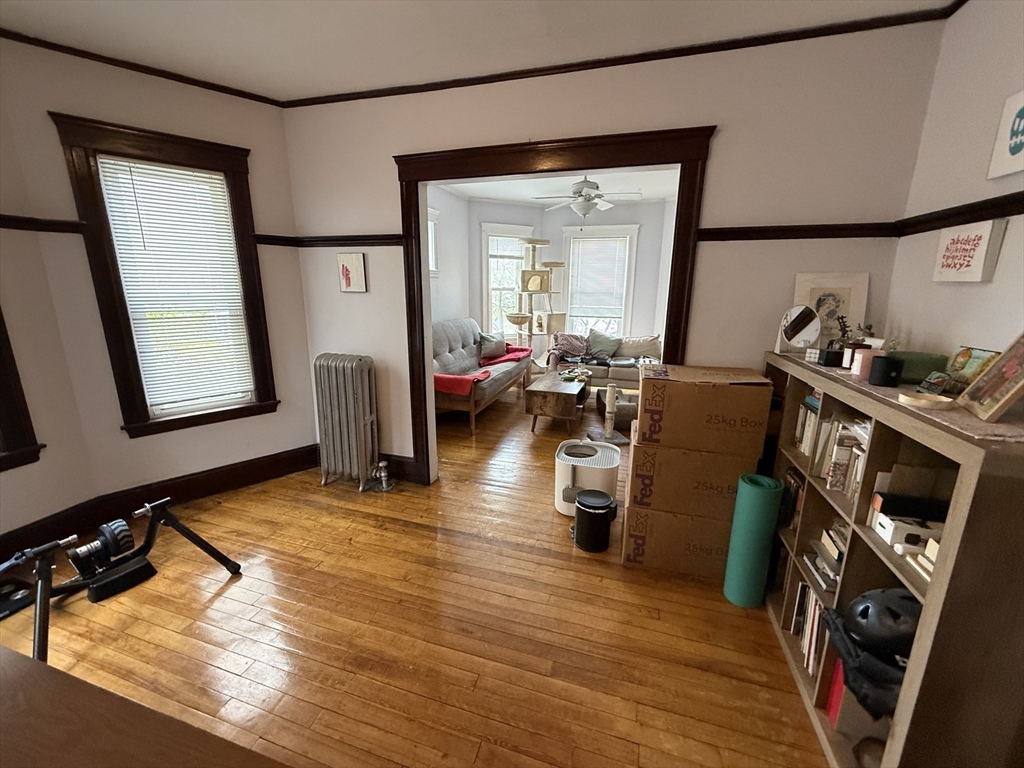 29 Lewis Street, Unit 1 Somerville, MA 02143 - Photo 7 of 16 a living room with furniture rug and wooden floor