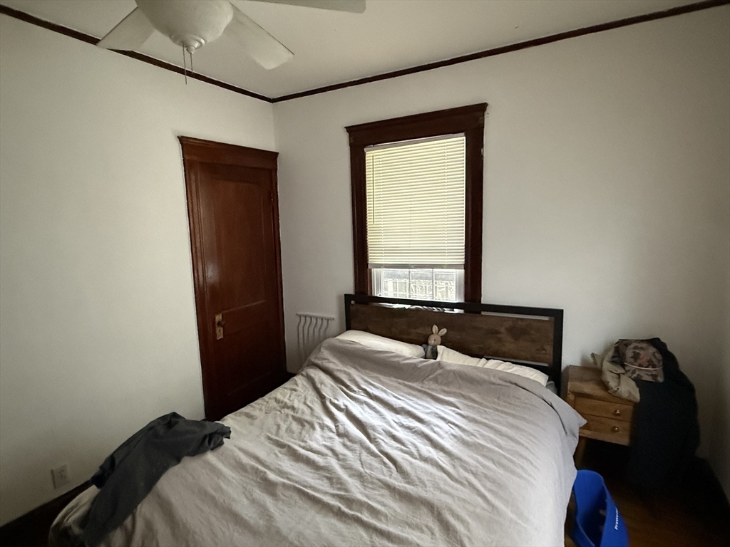 29 Lewis Street, Unit 1 Somerville, MA 02143 - Photo 9 of 16 a bedroom with a bed and a window