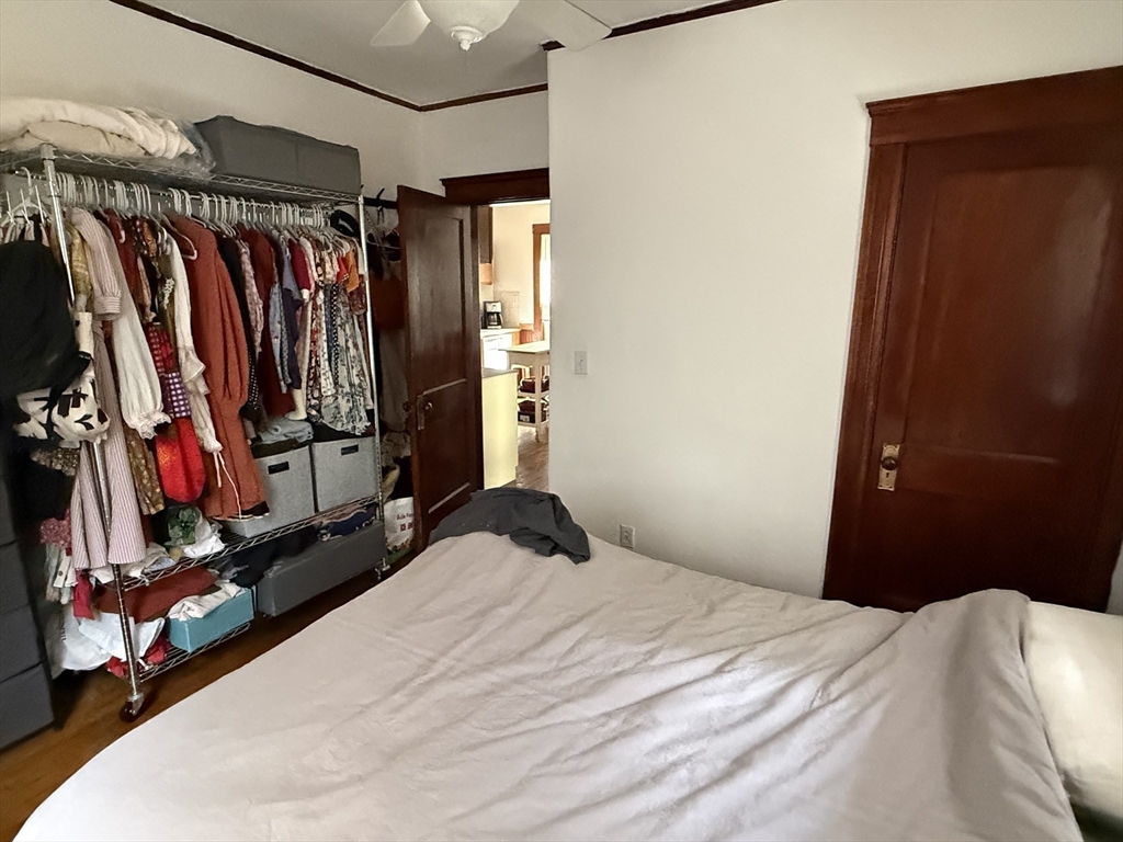 29 Lewis Street, Unit 1 Somerville, MA 02143 - Photo 10 of 16 a bedroom with a bed and a closet