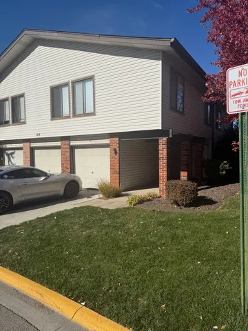 a view of a house with backyard and porch