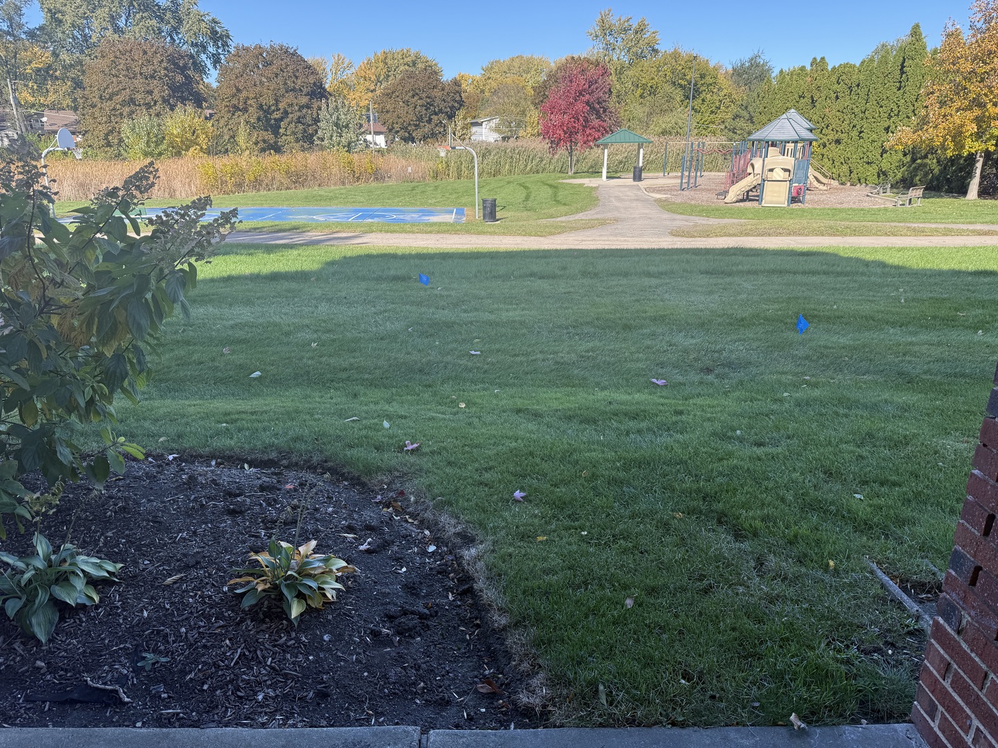 1319 Kingsbury Drive, Unit 2 Hanover Park, IL 60133 - Photo 17 of 44 a view of a lake with a yard