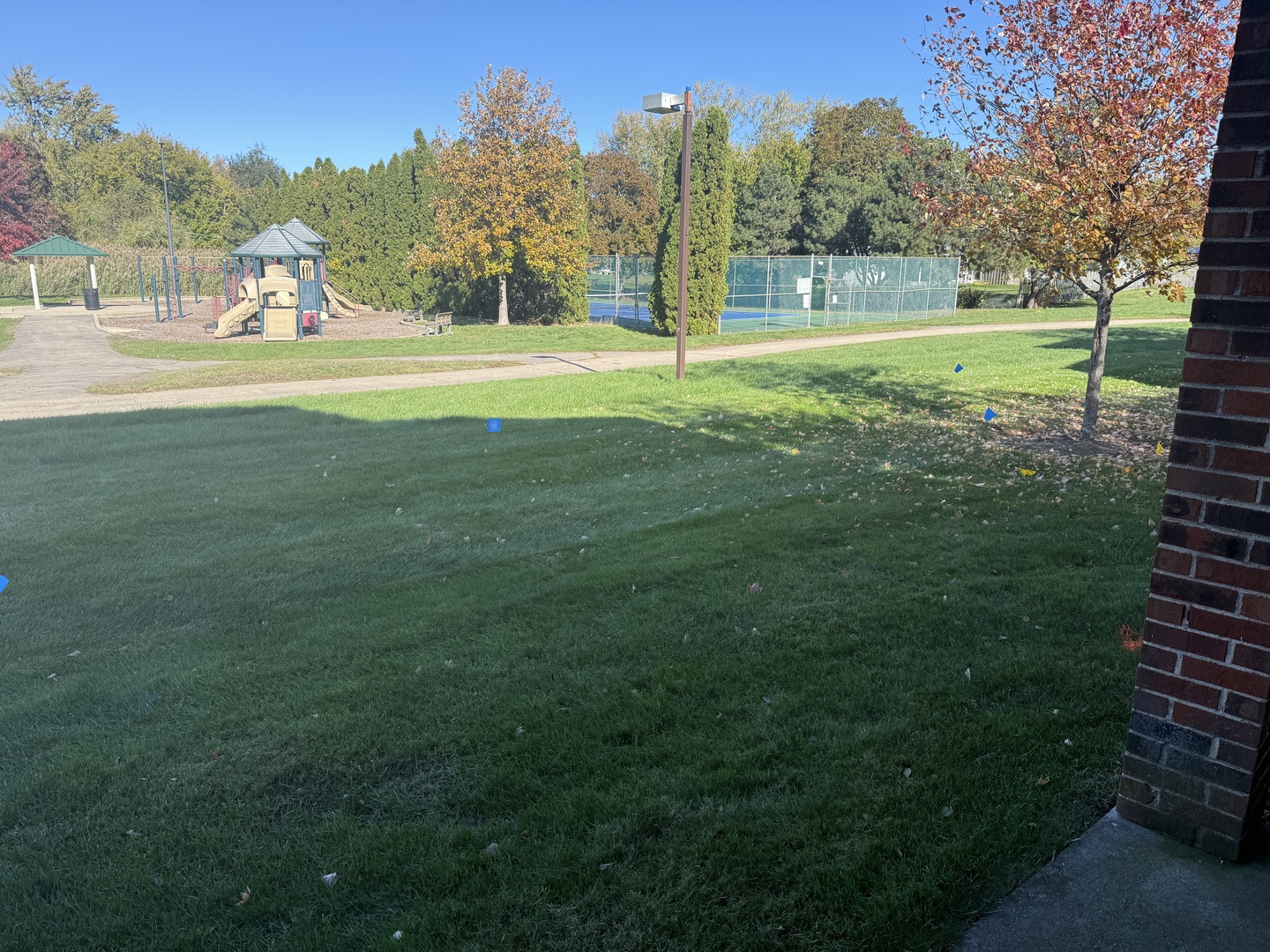 1319 Kingsbury Drive, Unit 2 Hanover Park, IL 60133 - Photo 18 of 44 a view of grassy field with trees