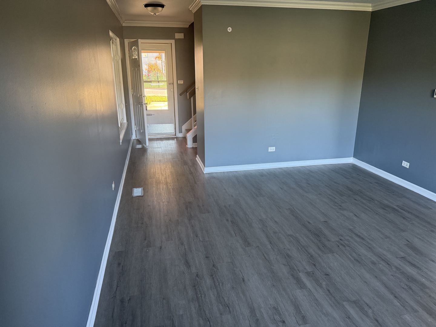 1319 Kingsbury Drive, Unit 2 Hanover Park, IL 60133 - Photo 3 of 44 a view of a hallway with wooden floor