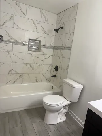 a view of front door with wooden floor