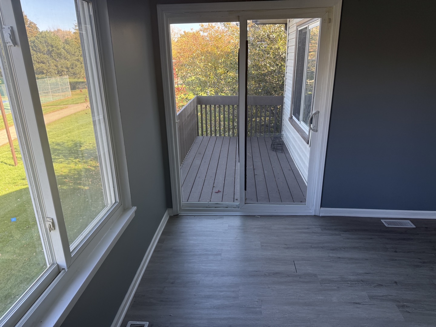 1319 Kingsbury Drive, Unit 2 Hanover Park, IL 60133 - Photo 40 of 44 a view of wooden floor in a room with a window
