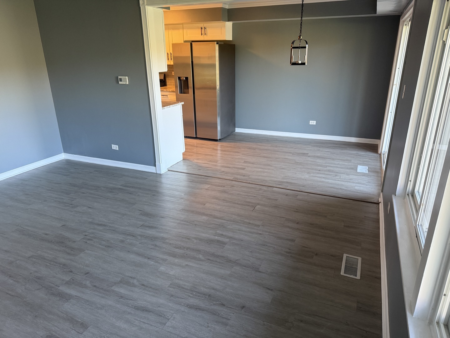 1319 Kingsbury Drive, Unit 2 Hanover Park, IL 60133 - Photo 5 of 44 a view of a hallway with wooden floor