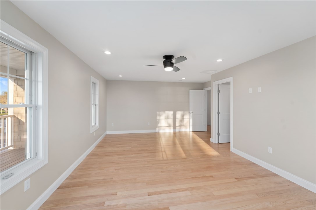 25 Scallop Shell Road Narragansett, RI 02882 - Photo 17 of 49 Long view of Primary Bedroom. Door opening in is to the huge walk in closet