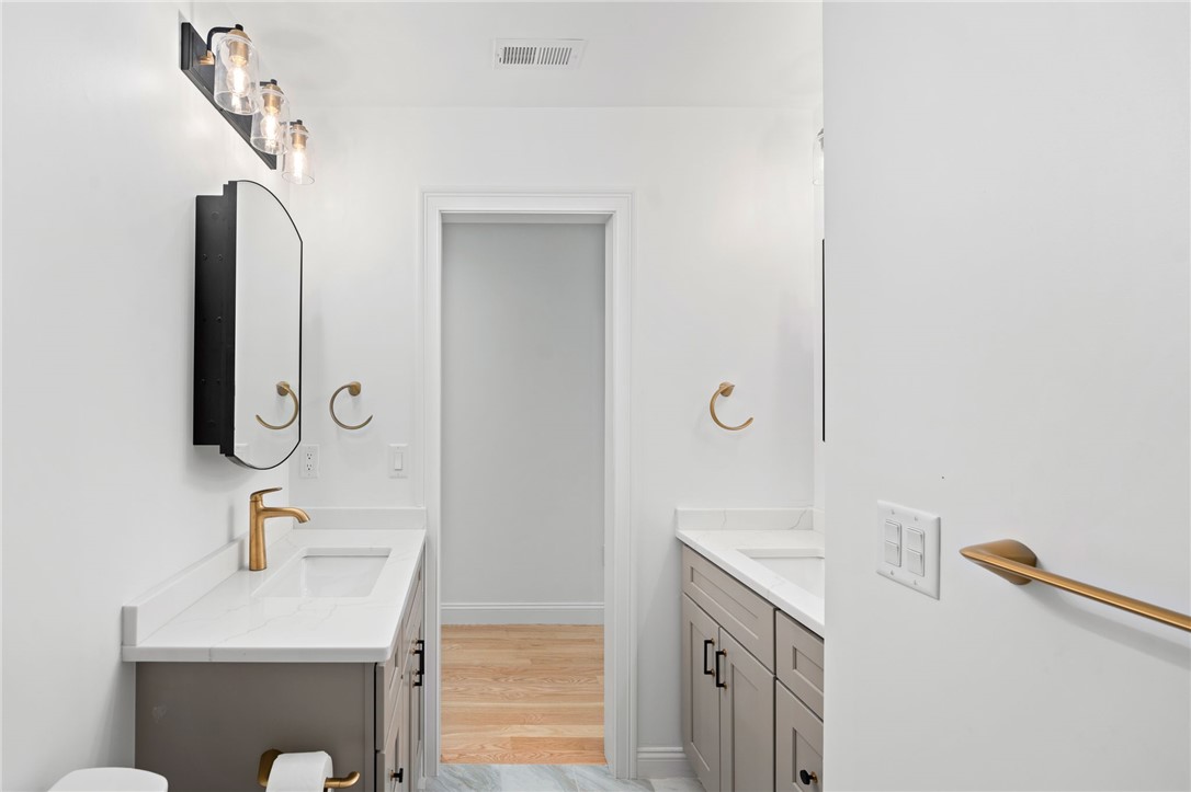 25 Scallop Shell Road Narragansett, RI 02882 - Photo 25 of 49 Thoughtful dual sinks in the Level 3 full bath