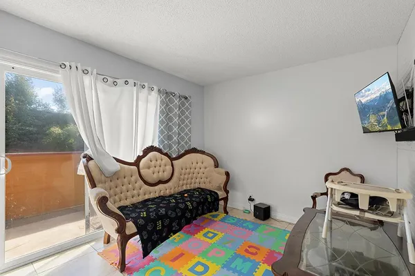 a bedroom with a bed and dresser
