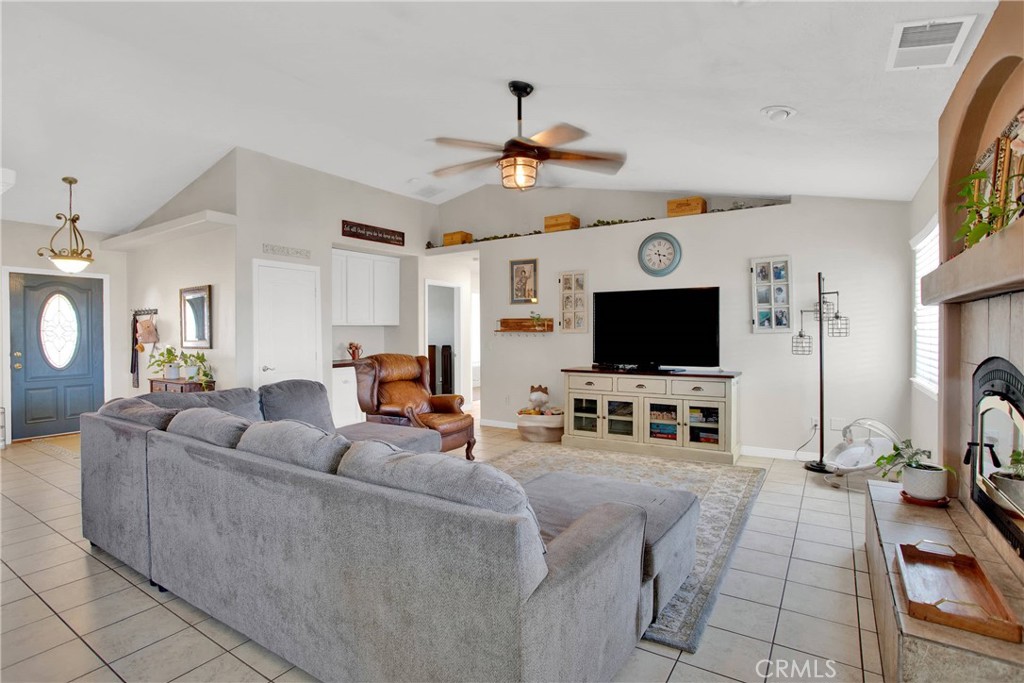 7330 Smoke Tree Road Phelan, CA 92371 - Photo 13 of 46 a living room with furniture and a flat screen tv