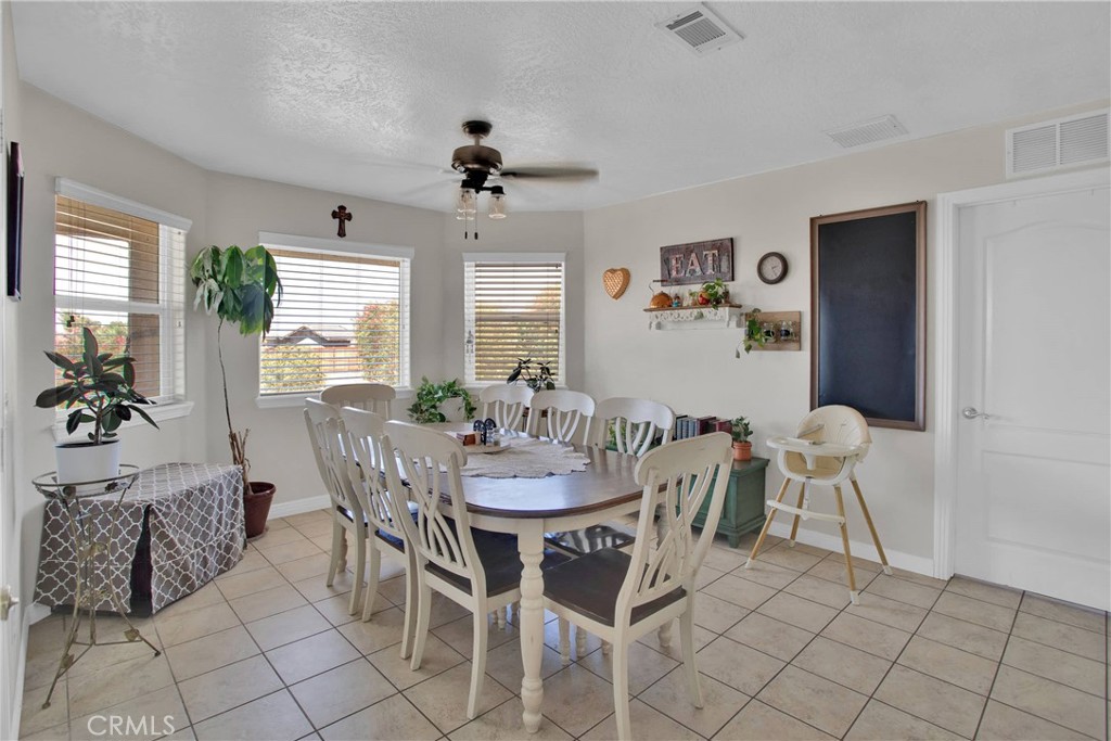 7330 Smoke Tree Road Phelan, CA 92371 - Photo 15 of 46 a view of a dining room with furniture