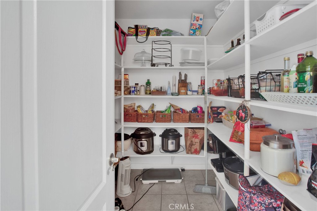 7330 Smoke Tree Road Phelan, CA 92371 - Photo 22 of 46 a room with storage and utility