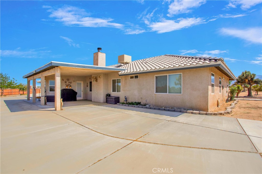 7330 Smoke Tree Road Phelan, CA 92371 - Photo 37 of 46 a view of a house with a patio