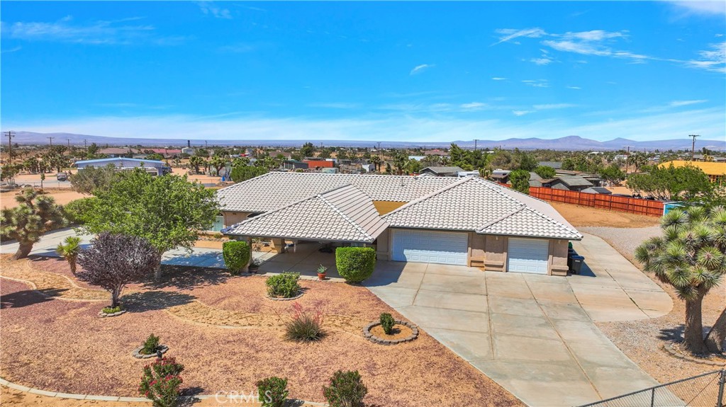 7330 Smoke Tree Road Phelan, CA 92371 - Photo 46 of 46 an aerial view of a house with a yard