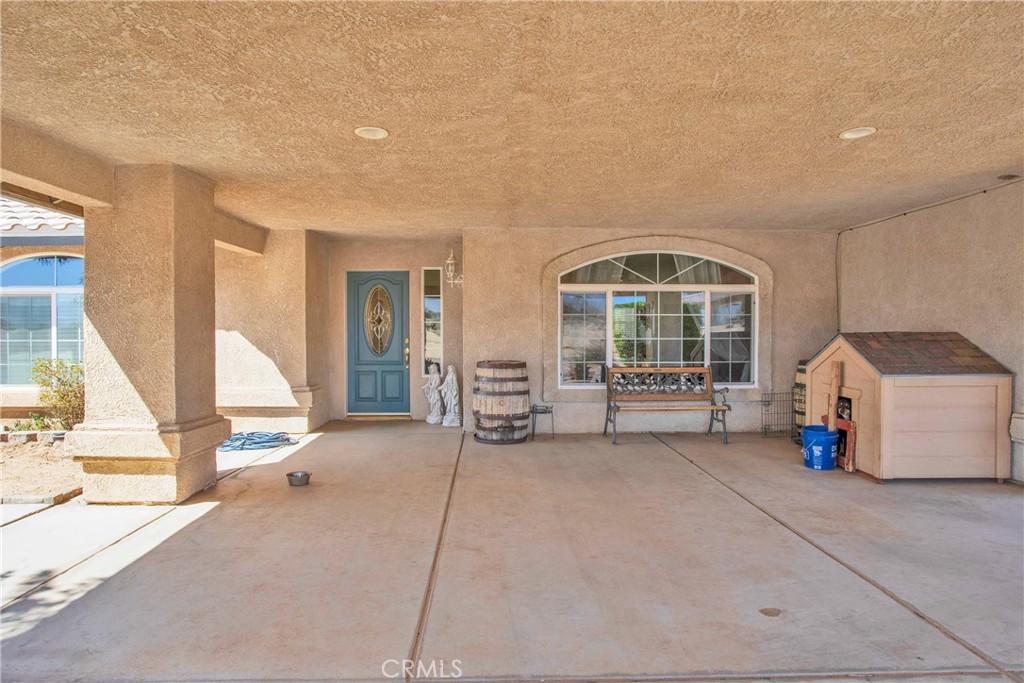 7330 Smoke Tree Road Phelan, CA 92371 - Photo 6 of 46 a view of an empty room with a window