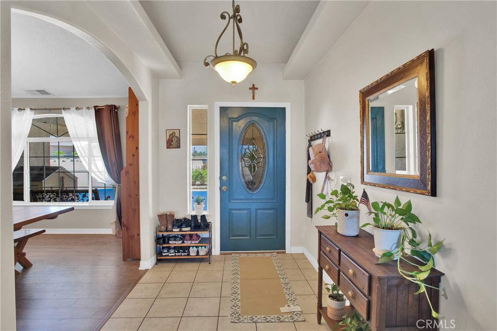 7330 Smoke Tree Road Phelan, CA 92371 - Photo 7 of 46 a lobby with furniture and a potted plant