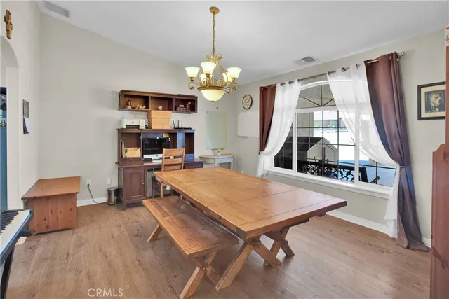 a very nice looking dining room with a table and chairs