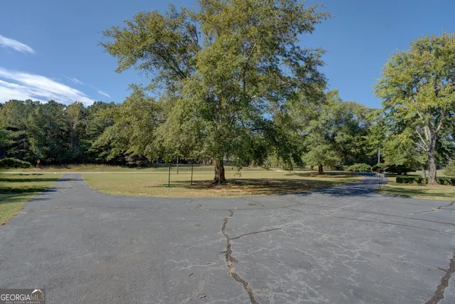 a view of swimming pool with a yard