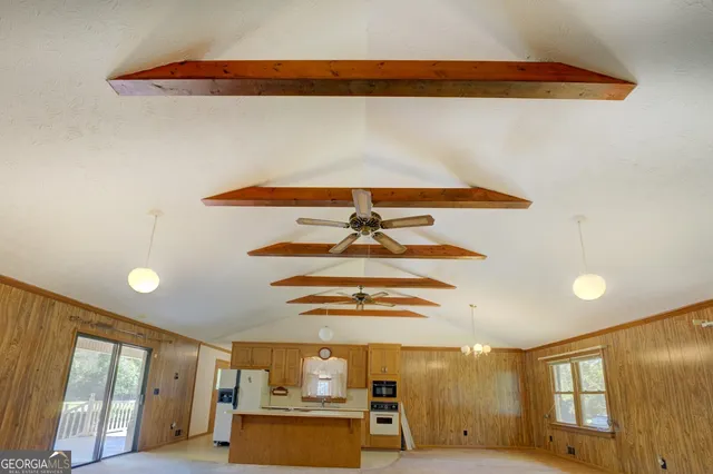 a view of a kitchen with furniture and a window