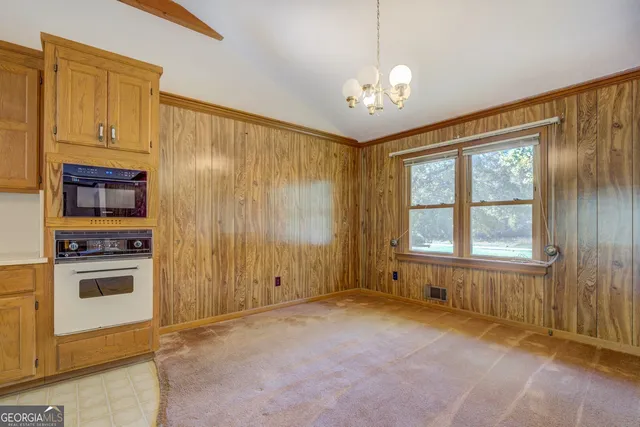 a view of a kitchen with a sink and cabinet