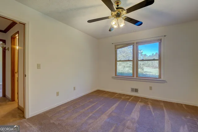 a bathroom with a sink shower and a mirror