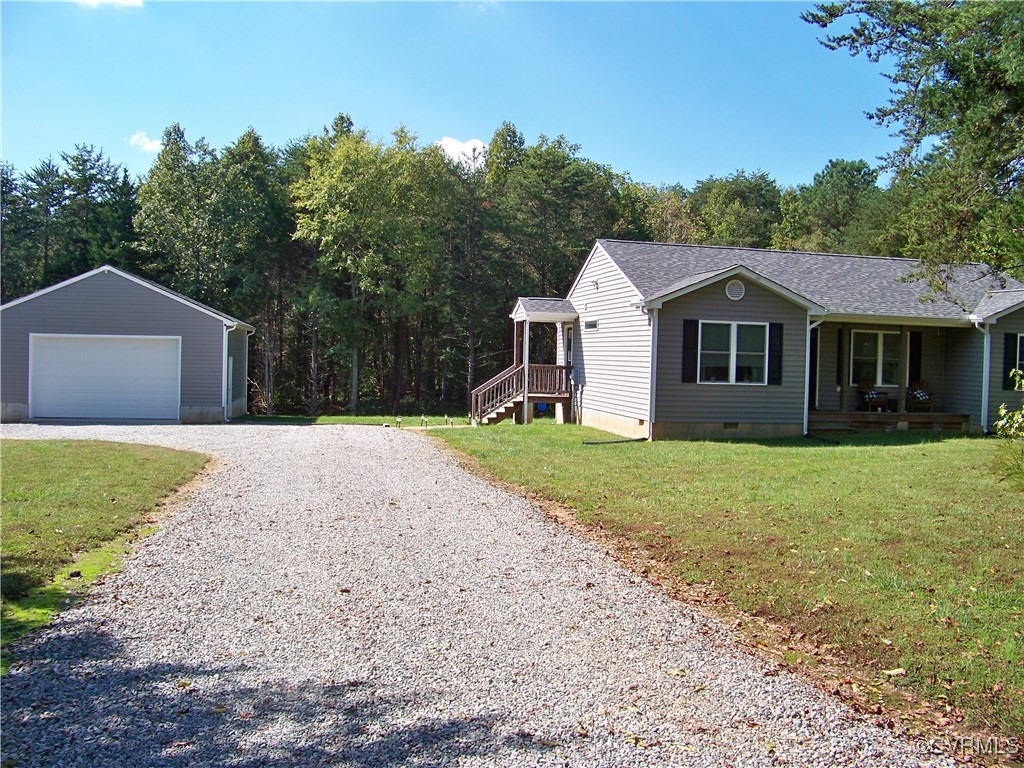 70 Rhodes Lane Cartersville, VA 23027 - Photo 40 of 40 View of side of home with a yard, an outbuilding,