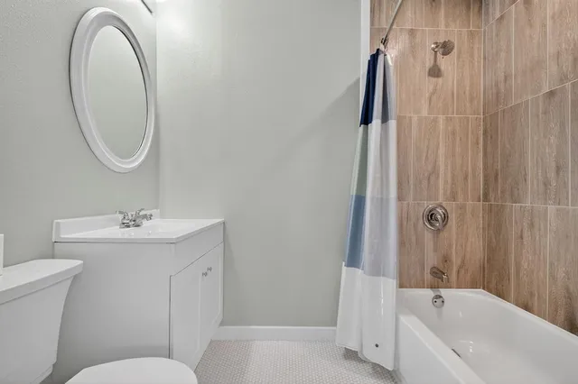 a view of a backyard with large trees