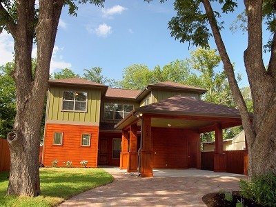 front view of a house with a tree
