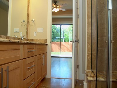 304 Zennia Street Austin, TX 78751 - Photo 12 of 26 a bathroom with a granite countertop sink and a mirror