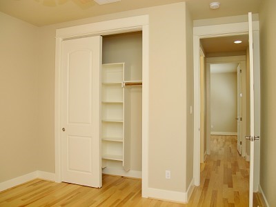 304 Zennia Street Austin, TX 78751 - Photo 14 of 26 a view of walk in closet with wooden floor
