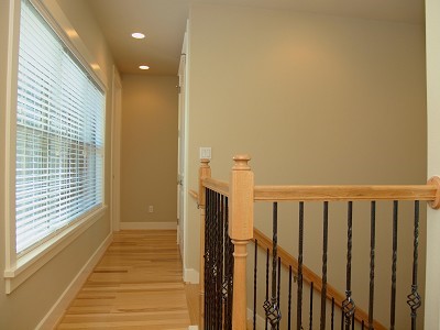 304 Zennia Street Austin, TX 78751 - Photo 19 of 26 a view of a hallway with wooden floor and staircase