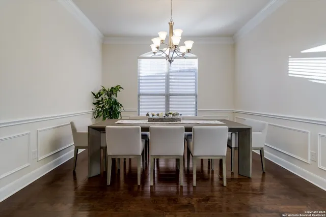 a view of a dining room with furniture and window