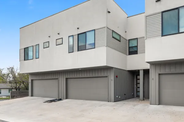 a front view of a building with garage