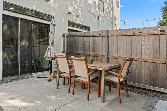 a view of a chairs and table in a patio