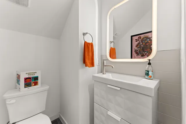 a bathroom with a toilet and a sink