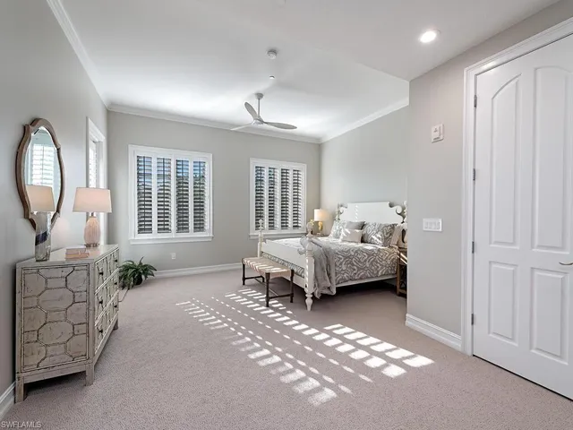 a bedroom with furniture and a window