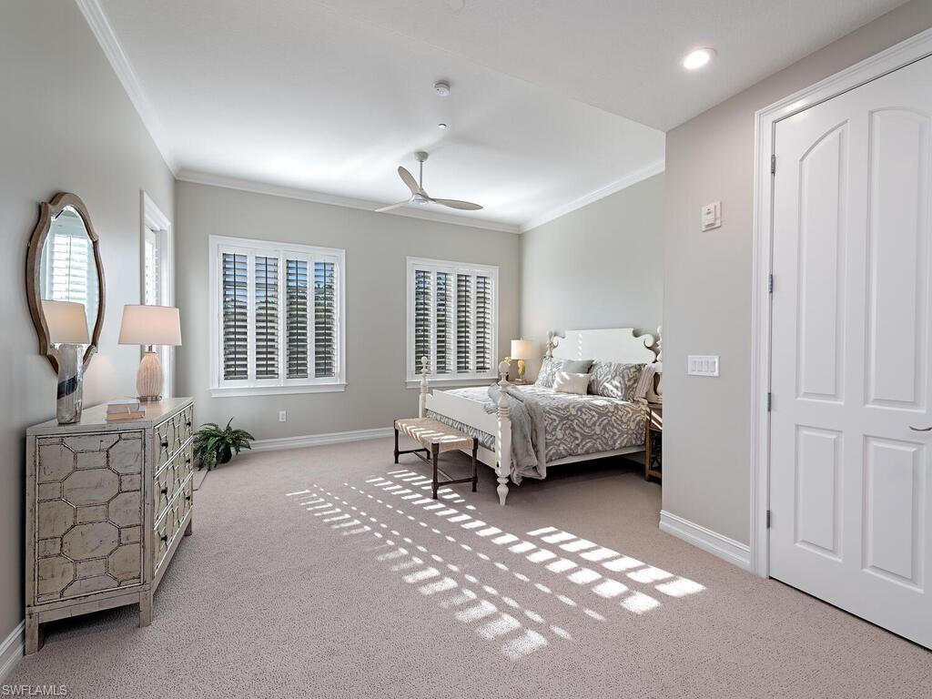 627 6th Avenue South, Unit B302 Naples, FL 34102 - Photo 6 of 14 a bedroom with furniture and a window