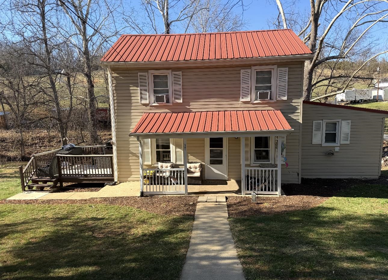 a patio with a table and chairs under an umbrella